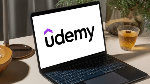 A laptop shows the Udemy logo, highlighting it as one of the top educational platforms for students